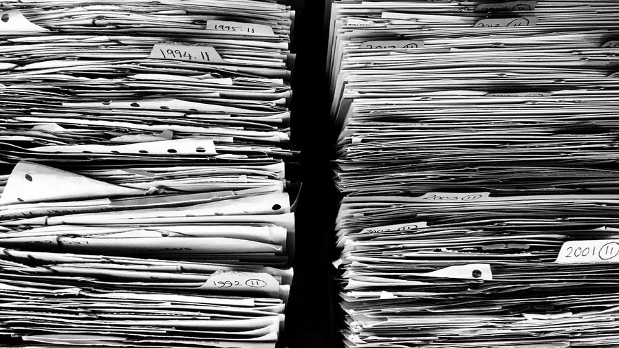 A stack of unopened paperwork