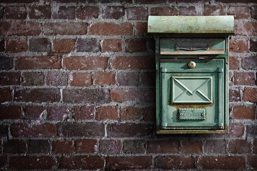 Post waiting in a wall letterbox