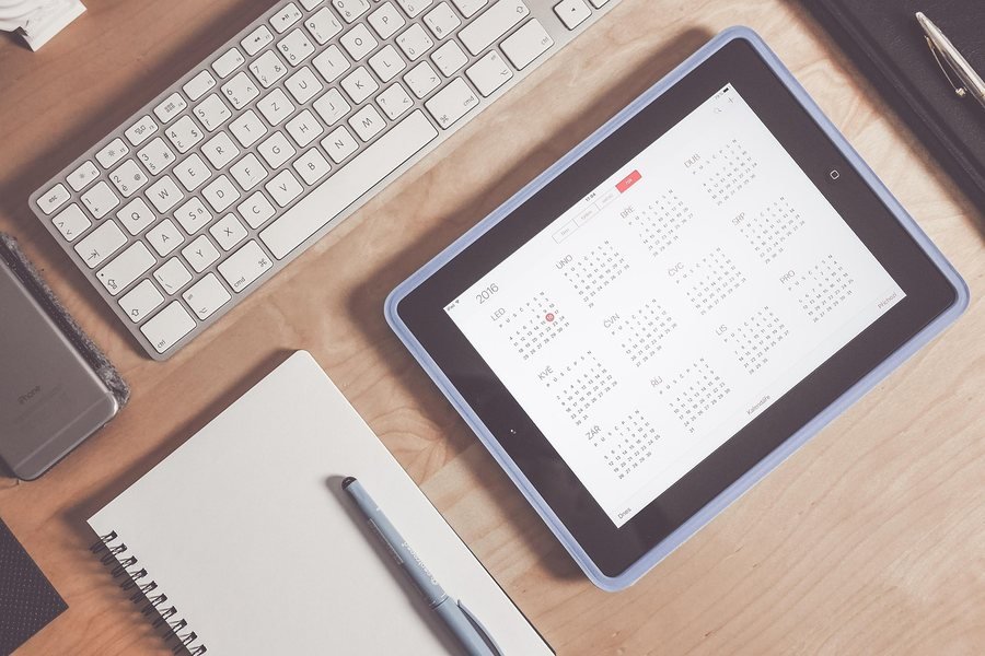 A planning calendar open on a desk
